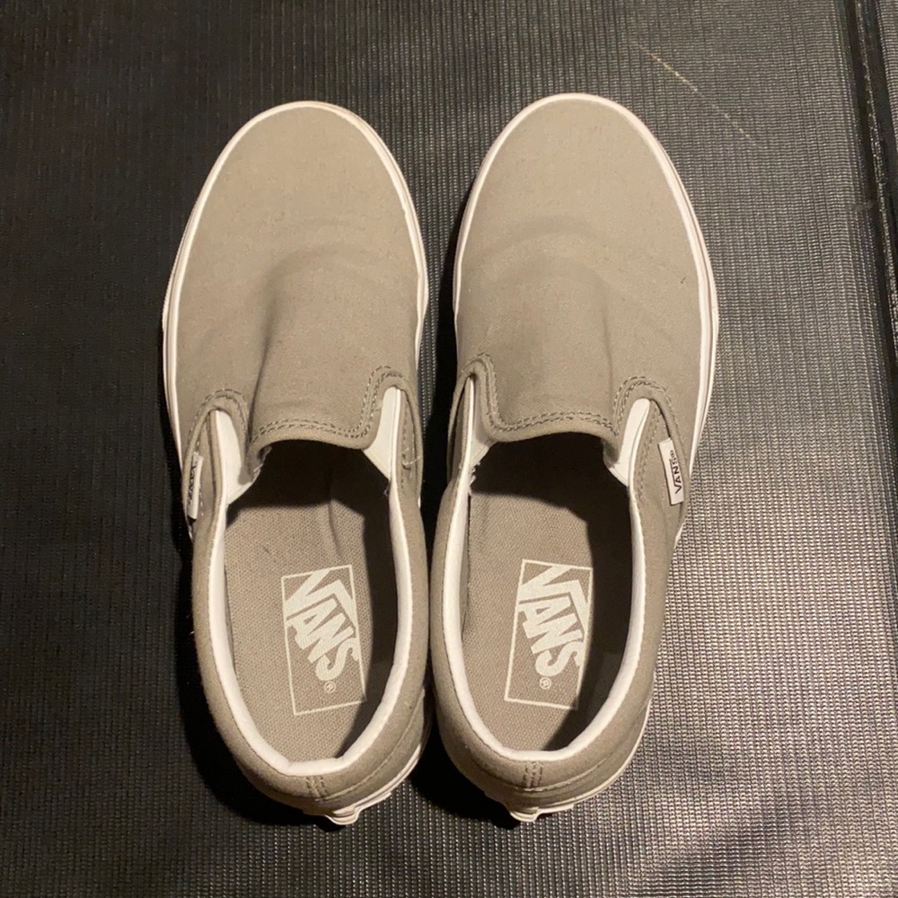 Gray slip on vans.